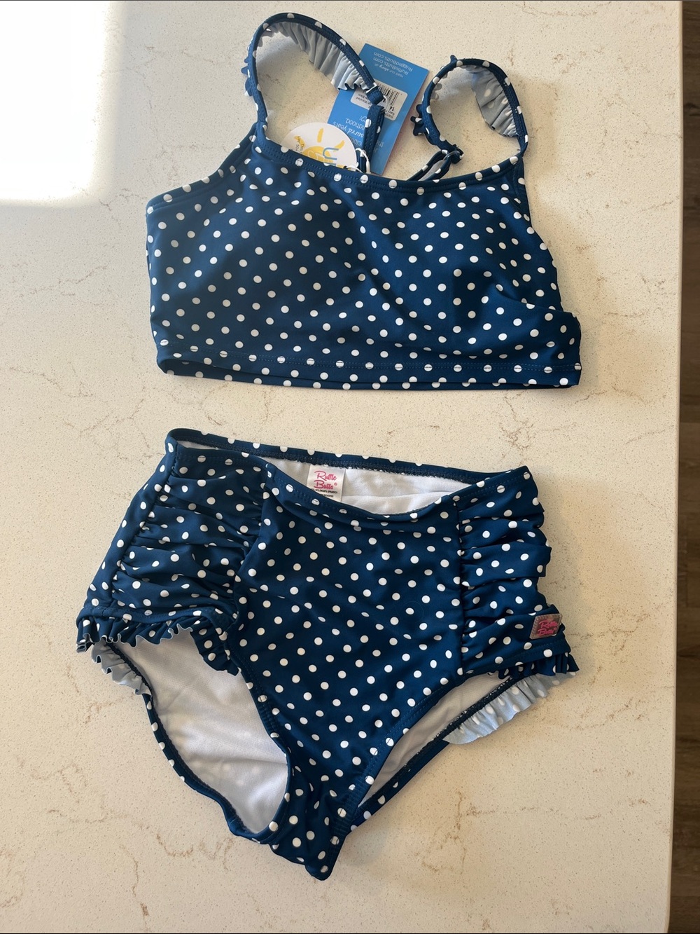 Ruffle Butts Navy Blue and White Polka Dot Girls Two-Piece Swim Set